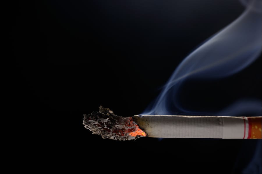 burning cigarette with smoke